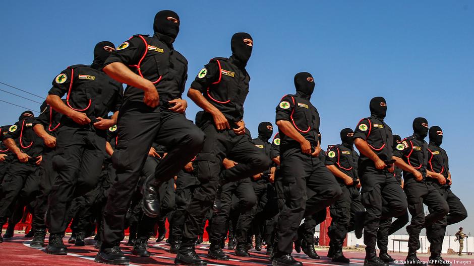 Members of Iraq's counterterrorism services running in formation (photo: Sabah Arar/AFP/Getty Images)