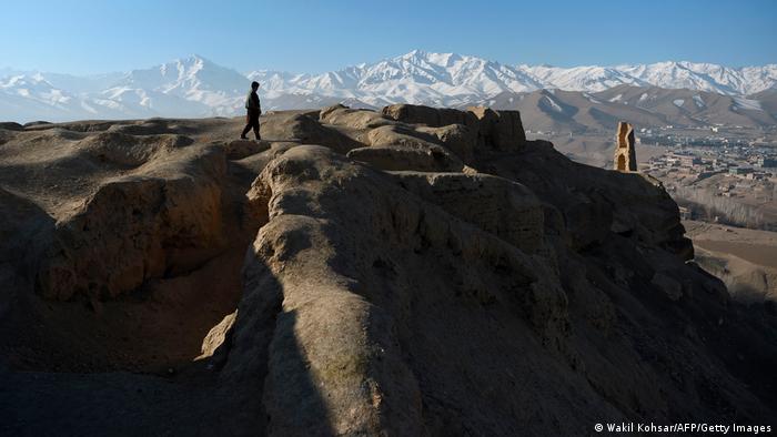 One person walks along a ridge in a mountainous area of Afghanistan