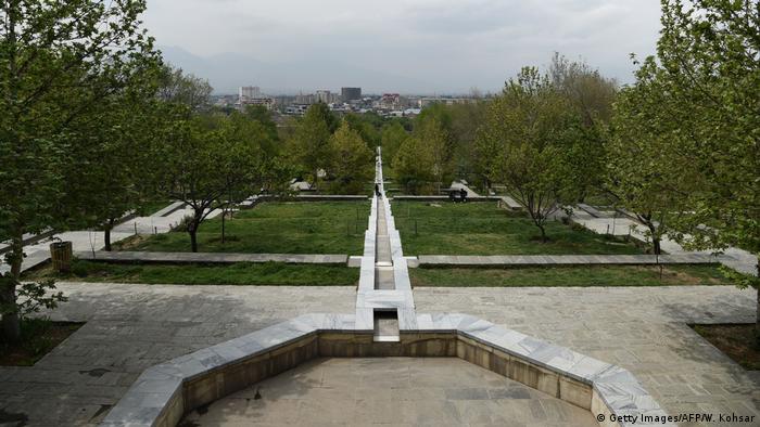 Bagh-e-Babur park in Kabul with an empty fountain, trees, lawns and terraces