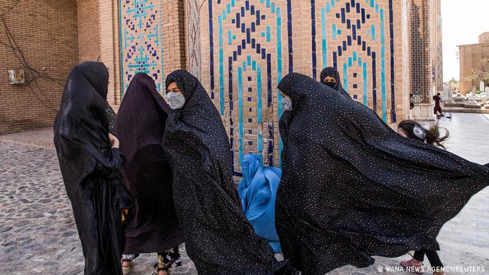 Afghan women walk at a mosque in Herat, Afghanistan, 10 September 2021