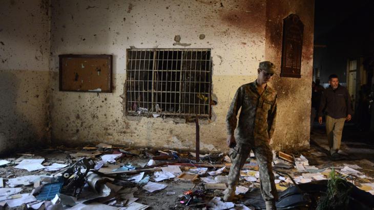 Pakistani army soldier walks through the Army Public School a day after the deadly attack by Taliban militants in Peshawar, December 2014 (photo: AFP/Getty Images/A. Majeed) 