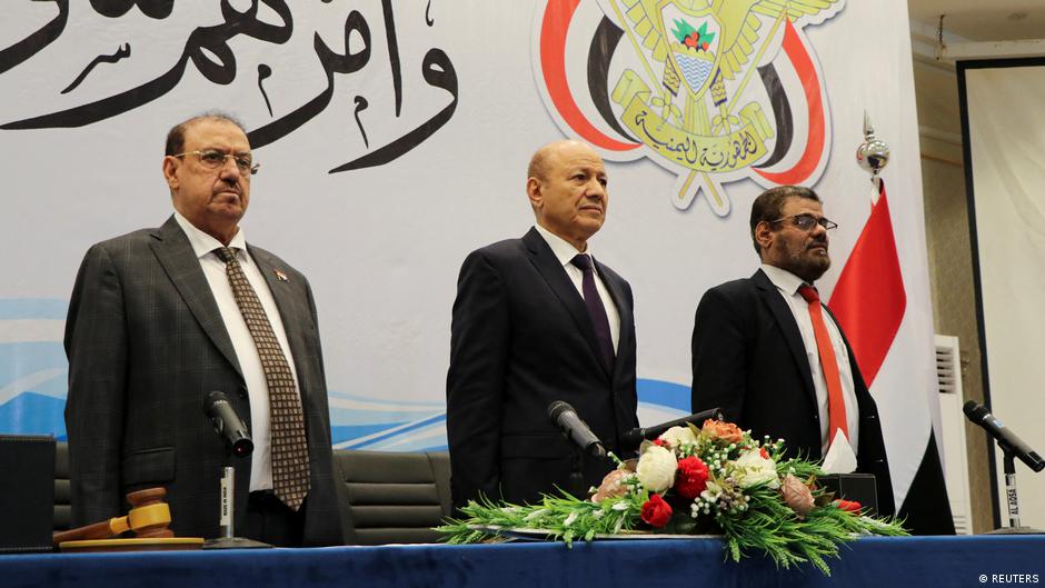 The head of Yemen's new presidential council Rashad al-Alimi stands during a session of the Yemeni parliament during which he and members of the presidential council took the oath in Aden, Yemen, 19 April 2022 (photo: Reuters/Wael al-Qubati)