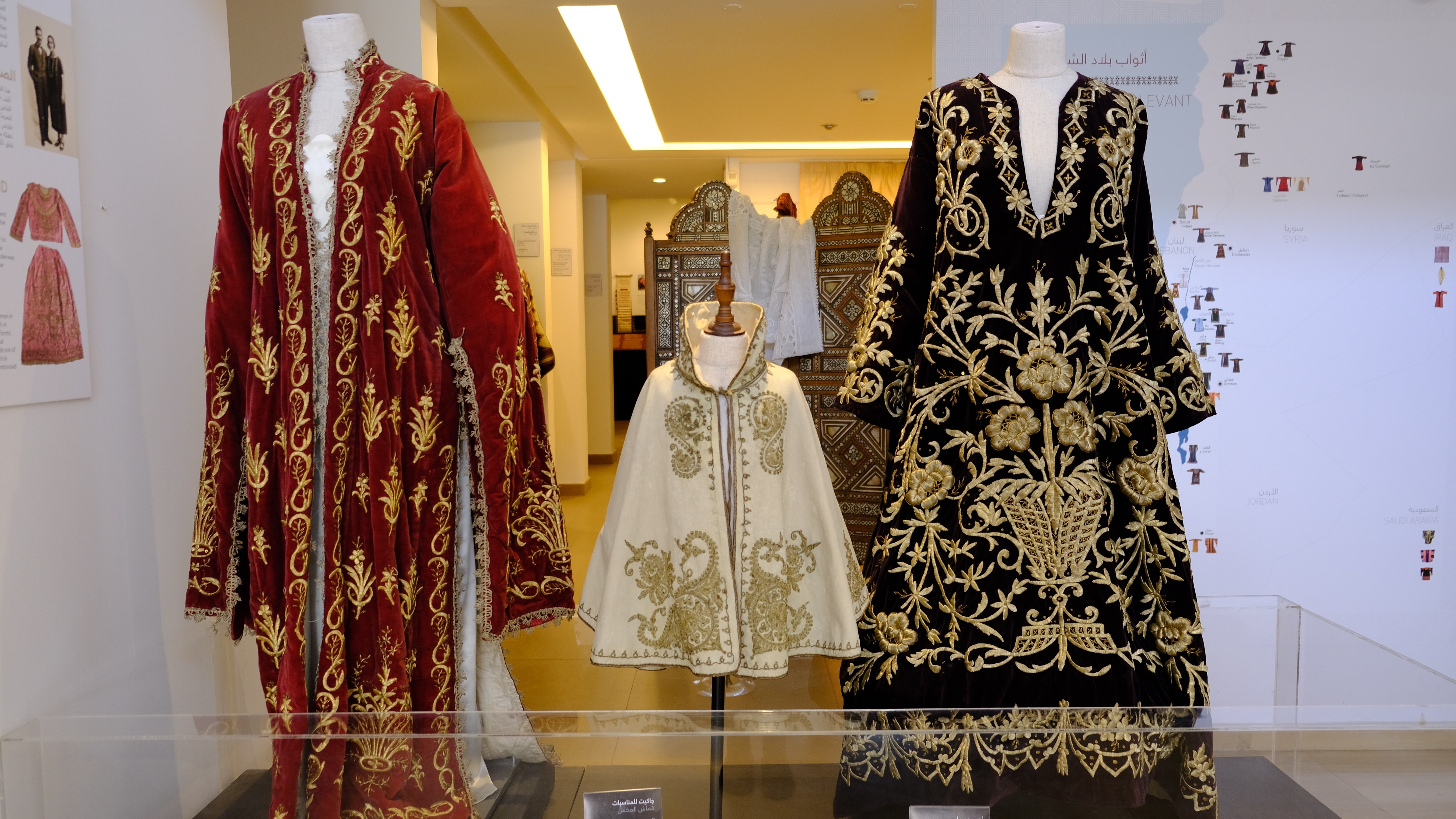 Luxurious early 20th-century dresses embroidered with gold thread; the dress on the right is a wedding dress from Palestine from 1910, the others from the 1920s (photo: Marta Vidal)