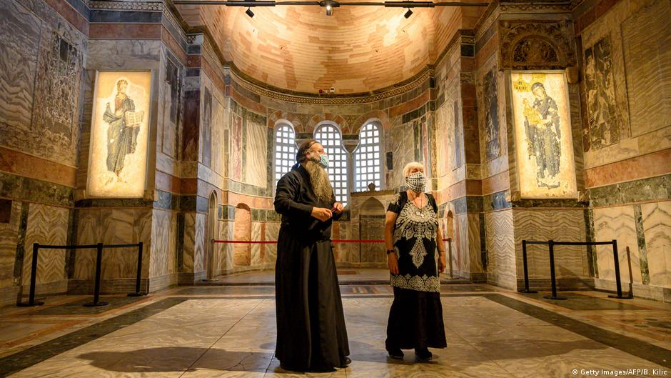 A priest and a woman visit the Chora Museum, formally the Church of the Holy Saviour, a medieval Byzantine Greek Orthodox church, Istanbul, August 2020 (photo: Getty Images/AFP/B. Kilic)