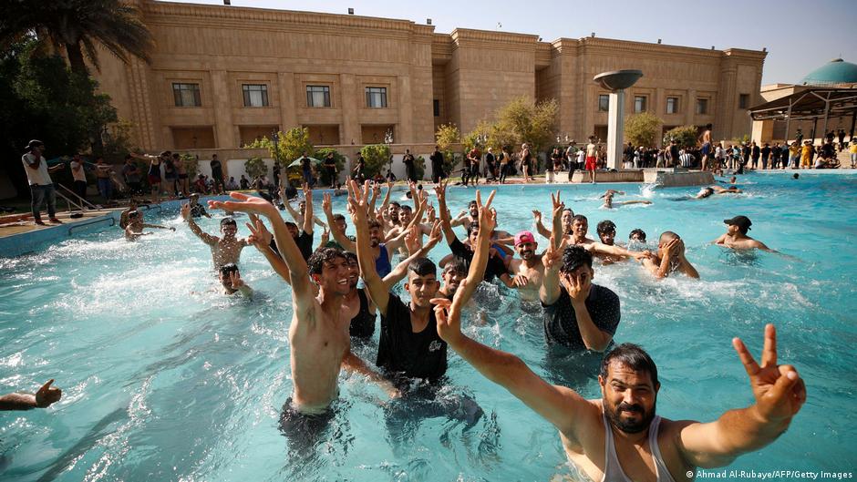 Muktada al-Sadr supporters in the swimming pool of the Palace of the Republic in Baghdad (photo: Ahmad al Rubaiye/AFP/Getty Images)