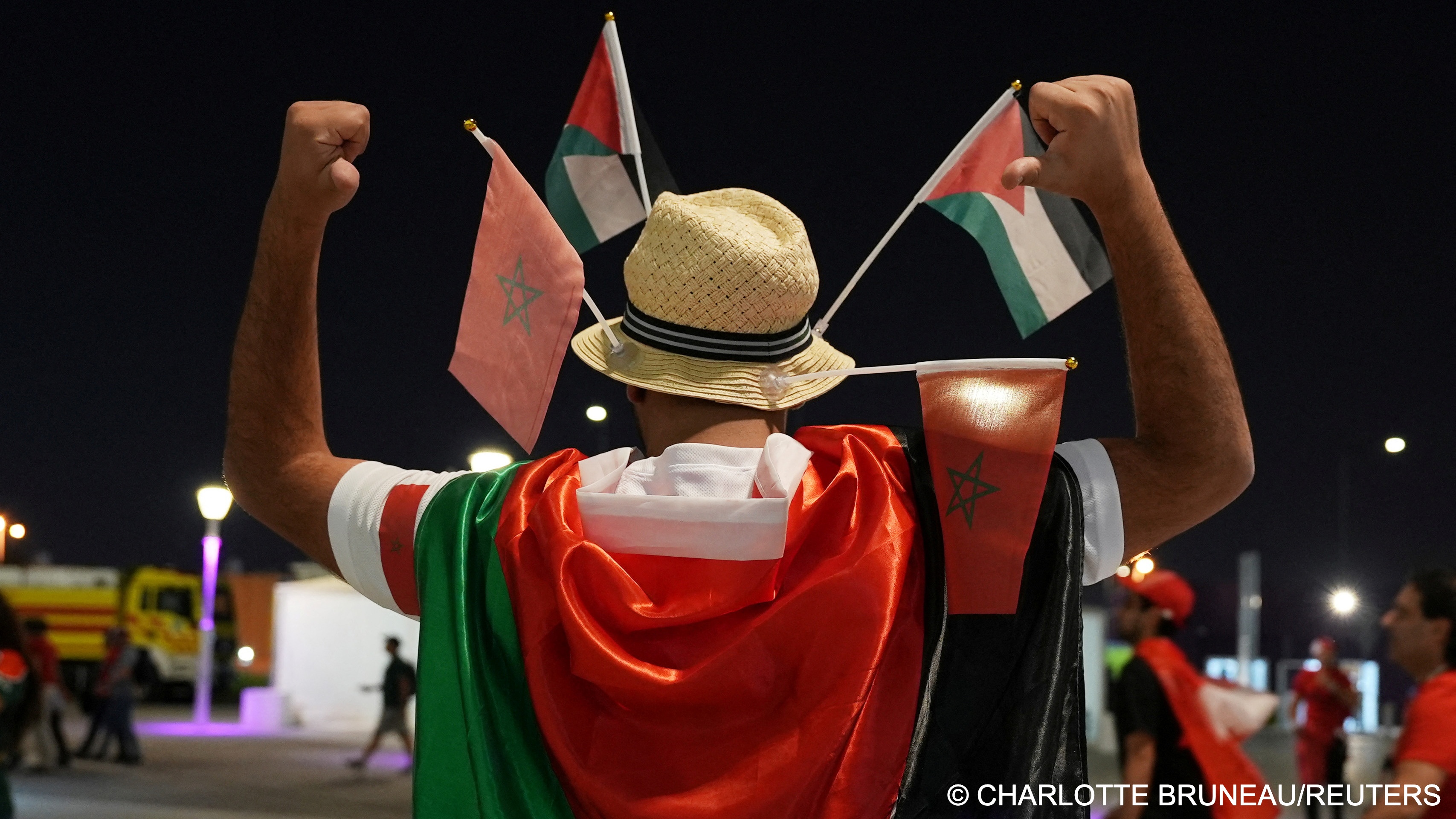 General view as a fan poses wearing a Palestine flag outside Al Thumama stadium, Doha, Qatar (photo: REUTERS/Charlotte Bruneau)