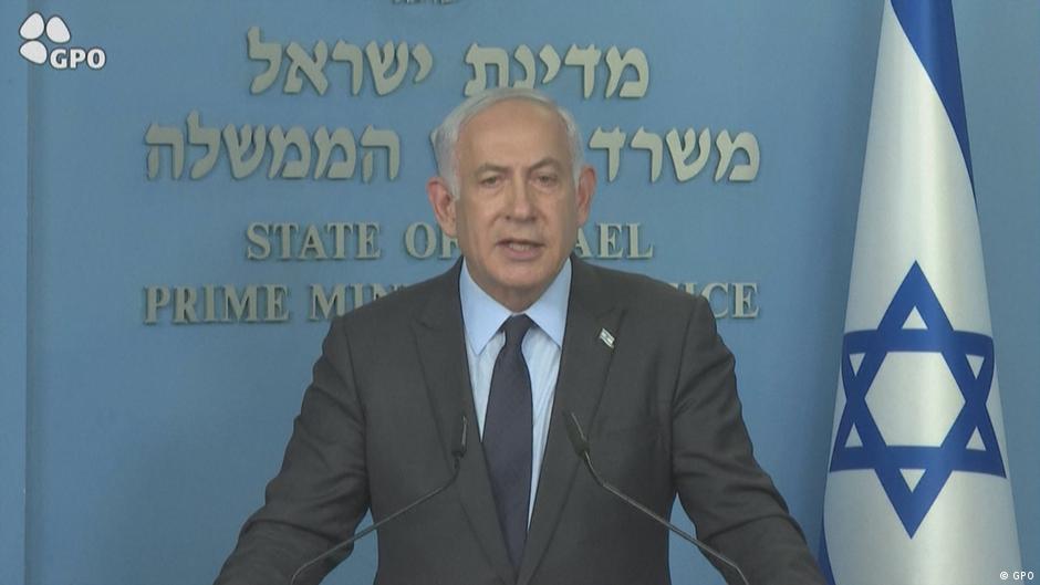 Israeli Prime Minister Benjamin Netanyahu in front of the country's flag (image: GPO)