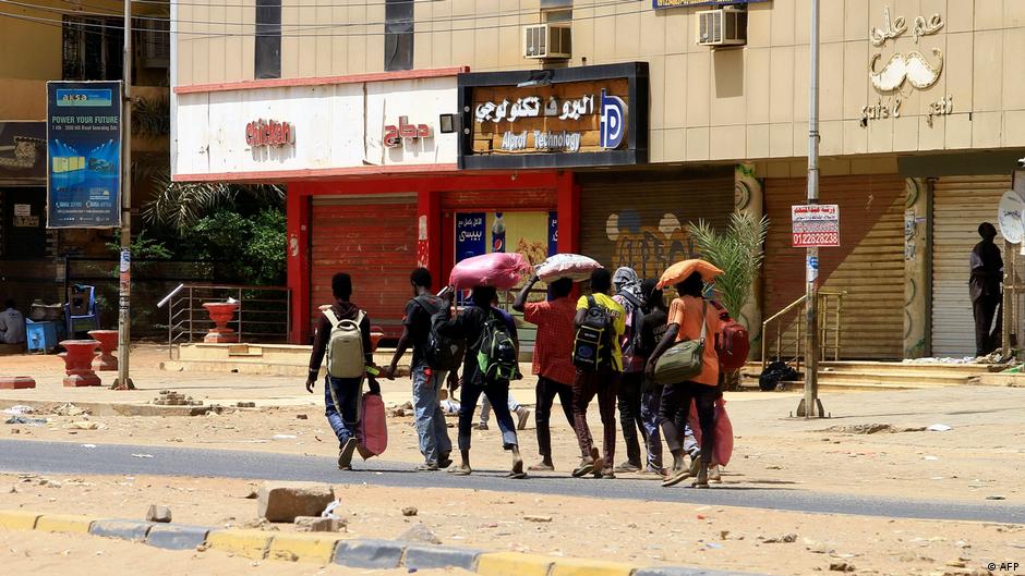 Civilians in Sudan fleeing to safety with the bare necessities (image: AFP)