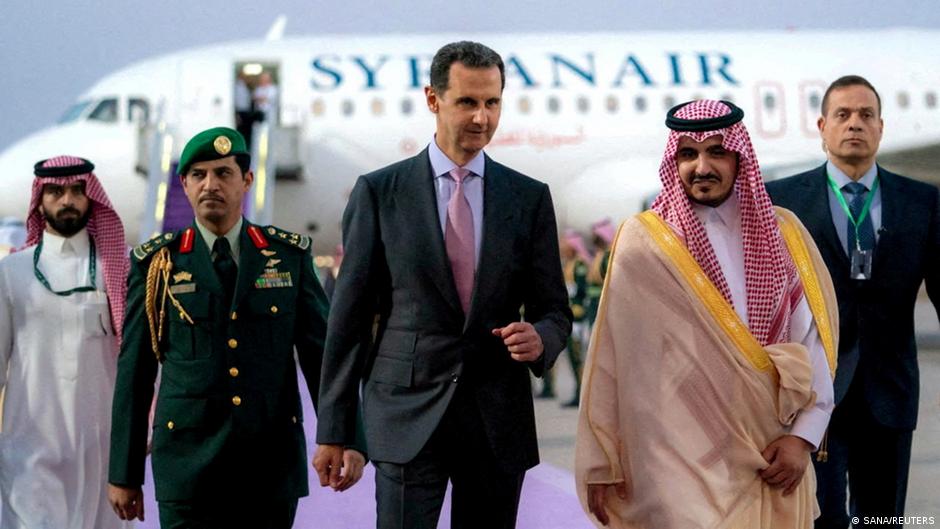 Assad with a representative of the Saudi government at the Arab League summit in Riyadh, May 2023 (image: SANA/REUTERS)