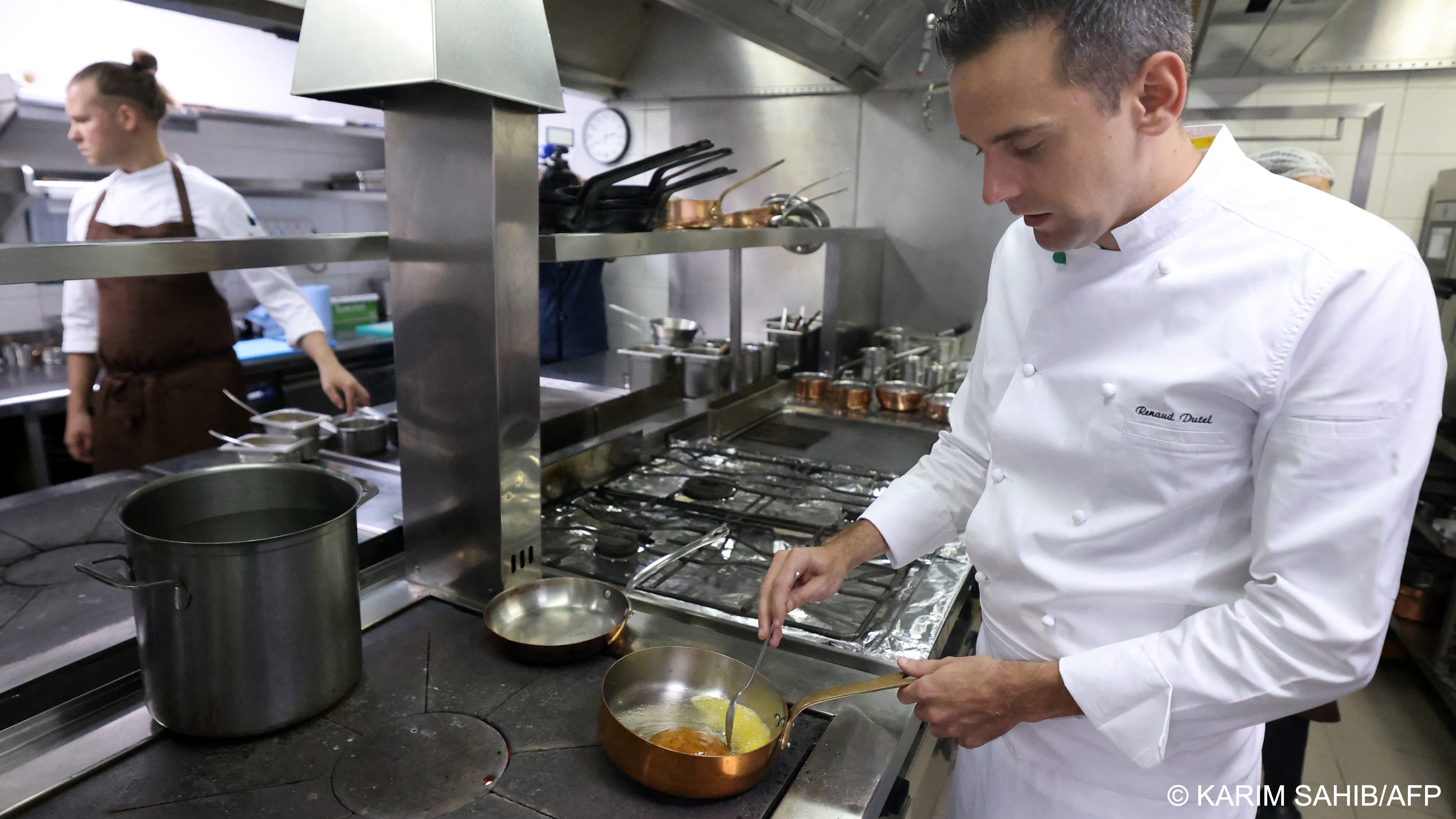 Chef working in a restaurant kitchen (image: Karim SAHIB/AFP) 