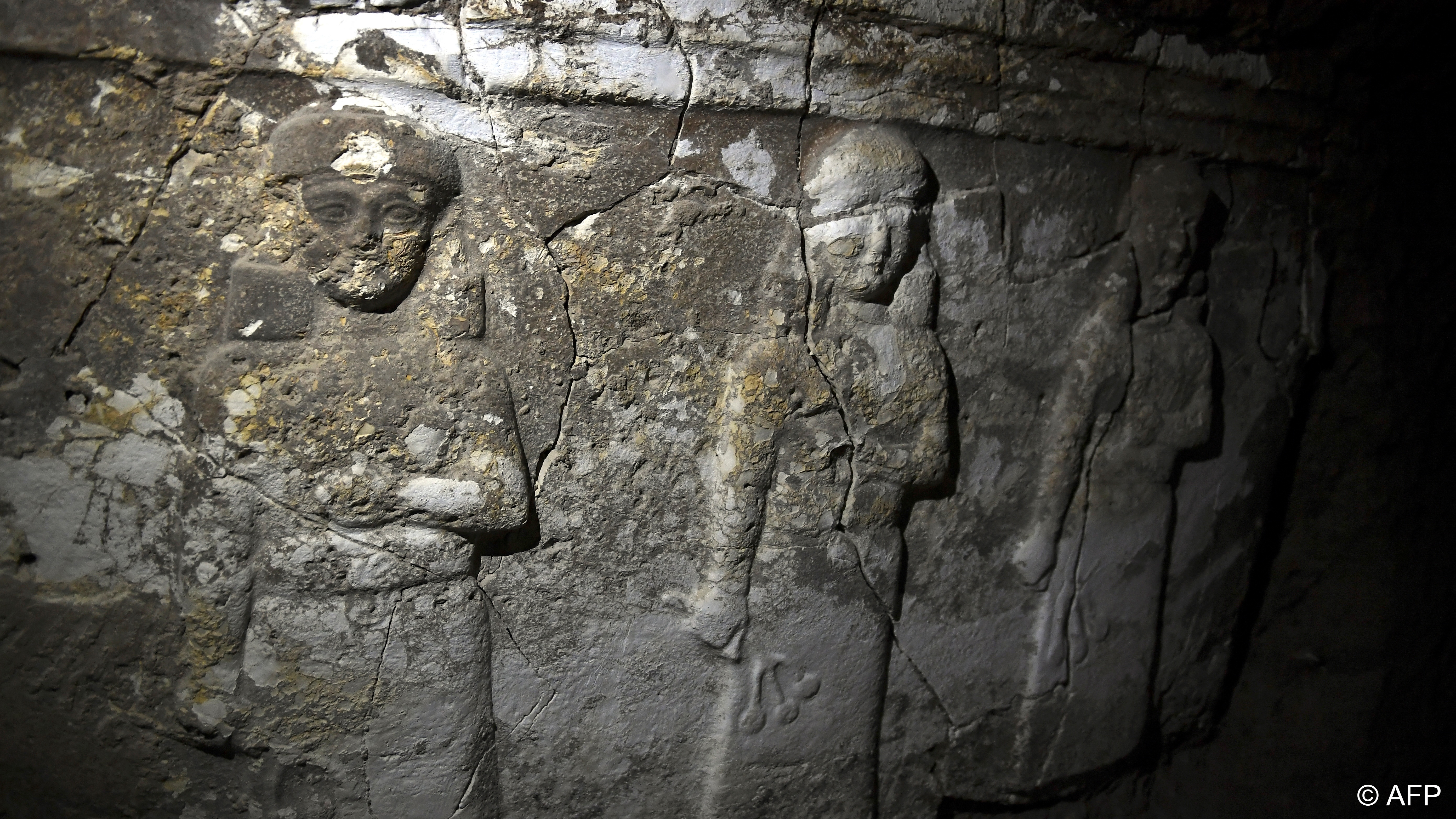 أنفاق النهب التي حفرها الجهاديون تحت مرقد النبي يونس - الموصل - العراق. Ancient carvings are pictured in a tunnel underneath the tomb of Jonah (Nabi Yunus) in eastern Mosul, Iraq (image: ARIS MESSINIS/AFP/Getty Images)