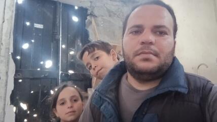Palestinian and Gaza City resident Ibrahim Kharabishi and two of his children