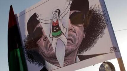 Anti-Gaddafi-Karikatur in Benghasi; Foto: AP