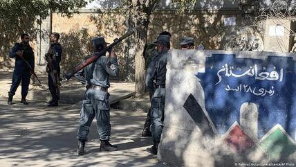 Afghanistan following the attacks on educational institutions: Afghan police guard an entrance to Kabul University