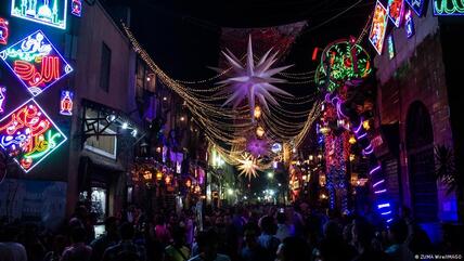 Cairo's city centre has turned festive ahead of Ramadan, albeit the economic situation has left many families struggling.