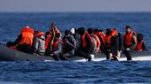 An inflatable dinghy carrying migrants crosses the English Channel on 6 March 2024