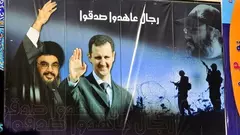 Poster of Syria's President Bashar al-Assad and Hezbollah chief Hassan Nasrallah (photo: picture alliance/ZB)