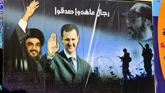 Plakat des syrischen Präsidenten Bashar al-Assad und des Hizbollah-Führers Hassan Nasrallah; Foto: picture alliance/ZB 